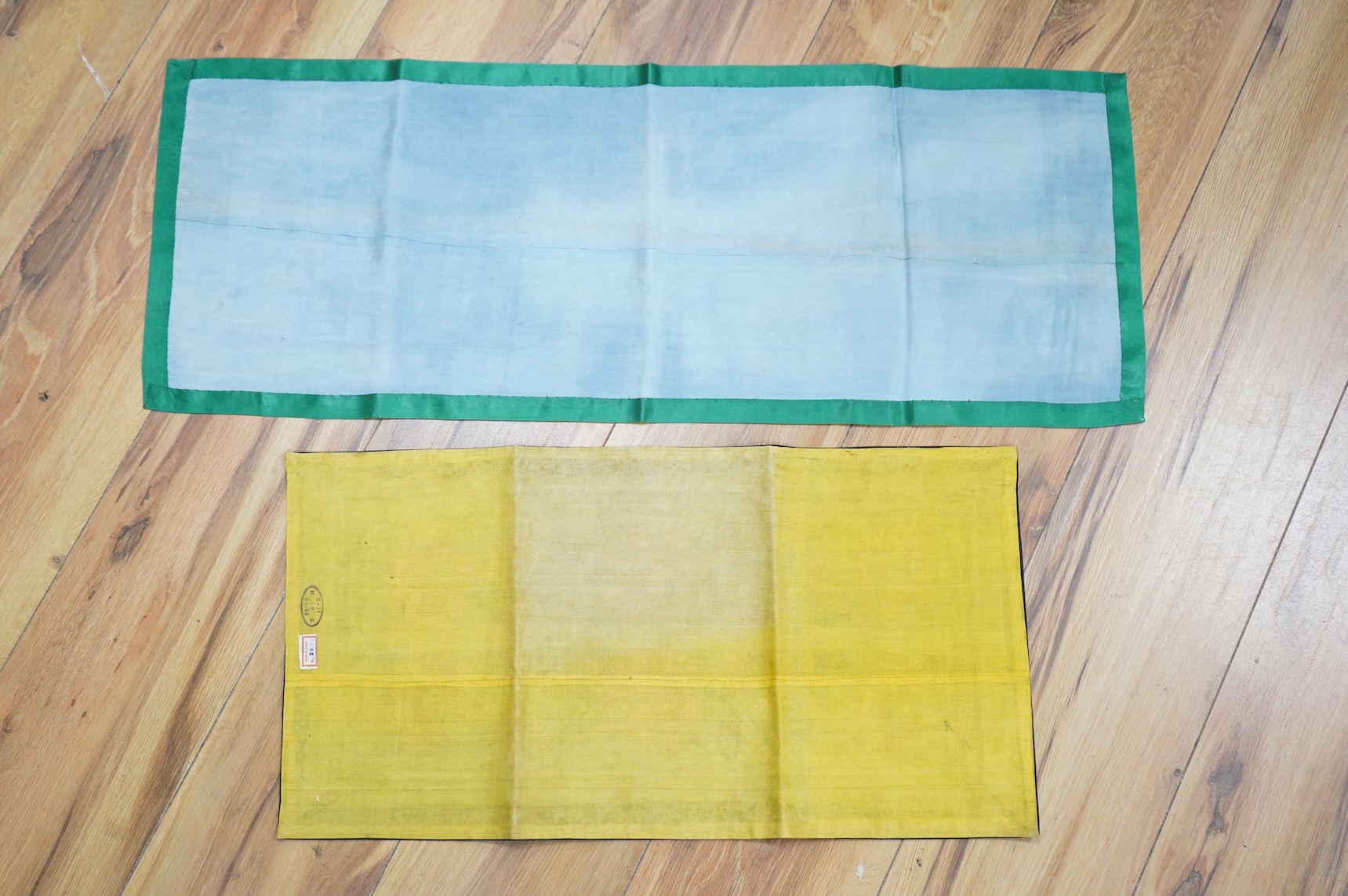 Two pairs of Chinese late 19th / early 20th century polychrome silk embroidered sleeve bands, now converted into two decorative table runners, one embroidered with large flowers using Peking knot, the other heavily embro